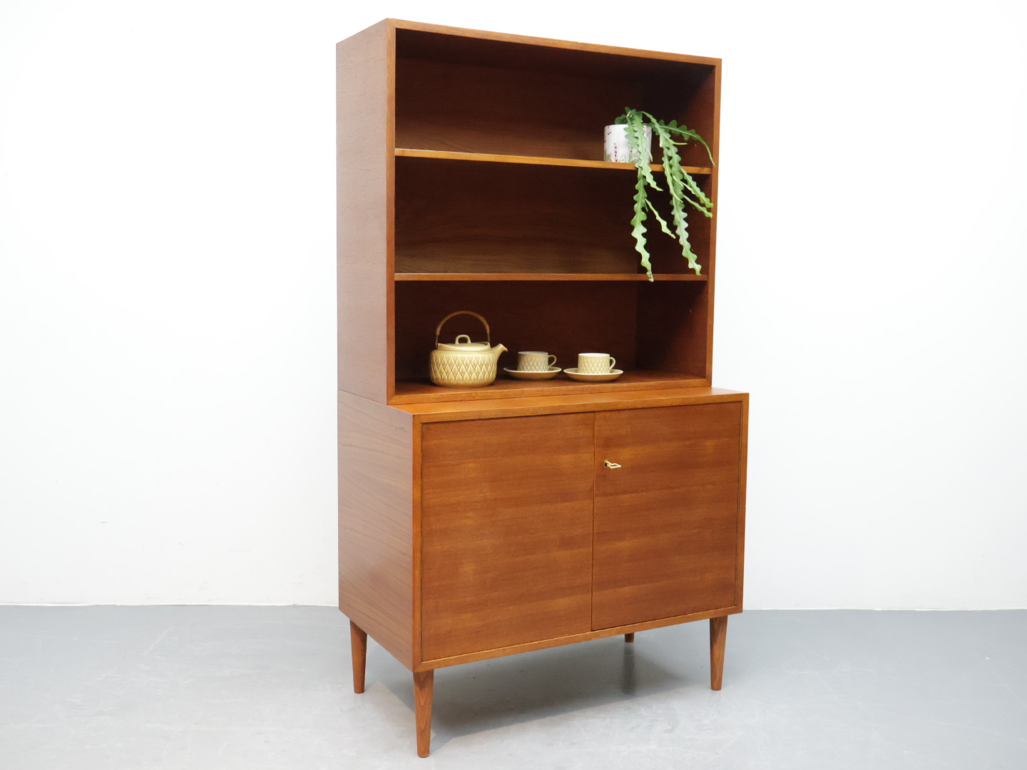 Vintage wandmeubel / 2-delig deur boekenplank / teak / conische poten